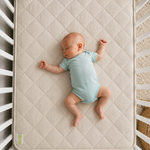 baby sleeping on kub natural mattress