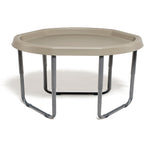 Hexagonal beige plastic table with metal legs on a white background