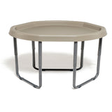Hexagonal beige plastic table with metal legs on a white background